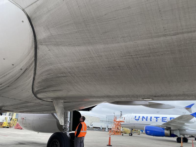 Underbody of a Boeing airplane with dirt, turbine exhaust, etc.